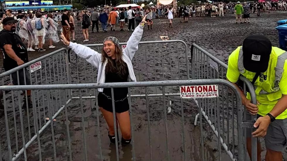 Featured image Woman trapped in kneedeep mud pit at Lollapalooza
