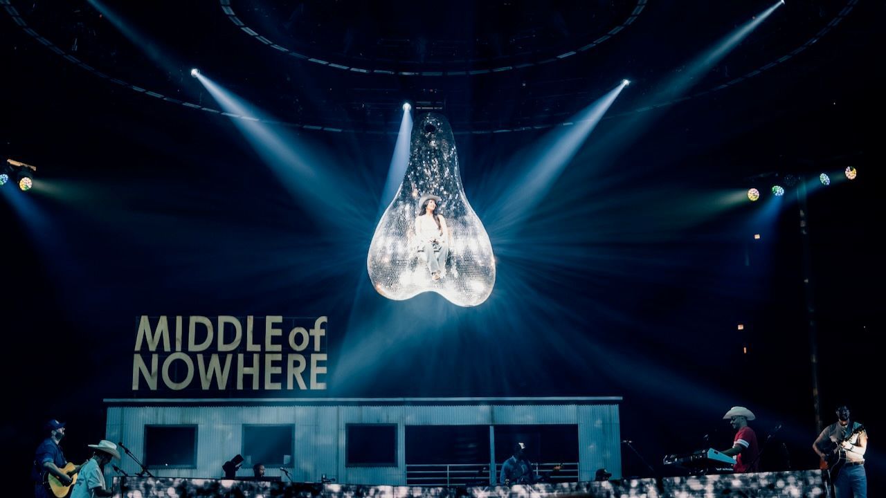 Featured image Kacey Musgraves hangs from disco balls at tour kickoff
